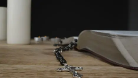 Tracking Shot Depicting Crucifix with a Holy Bible