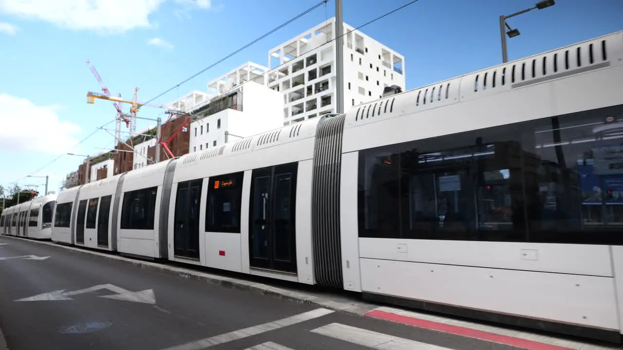 Brand new tram departing train platform in Tel Aviv light rail close up