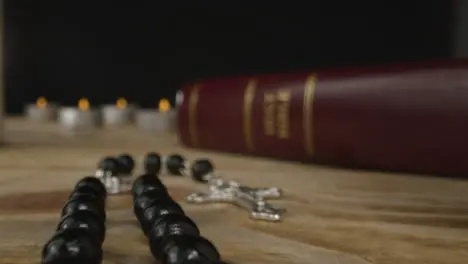 Tracking Shot of a Crucifix and Holy Bible