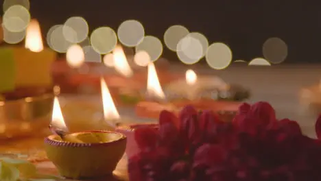 Close Up Of Burning Lamps With Flowers Celebrating Festival Of Diwali 1