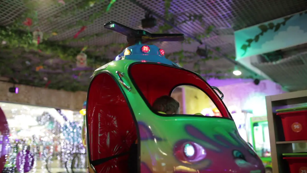 Boy in amusement helicopter