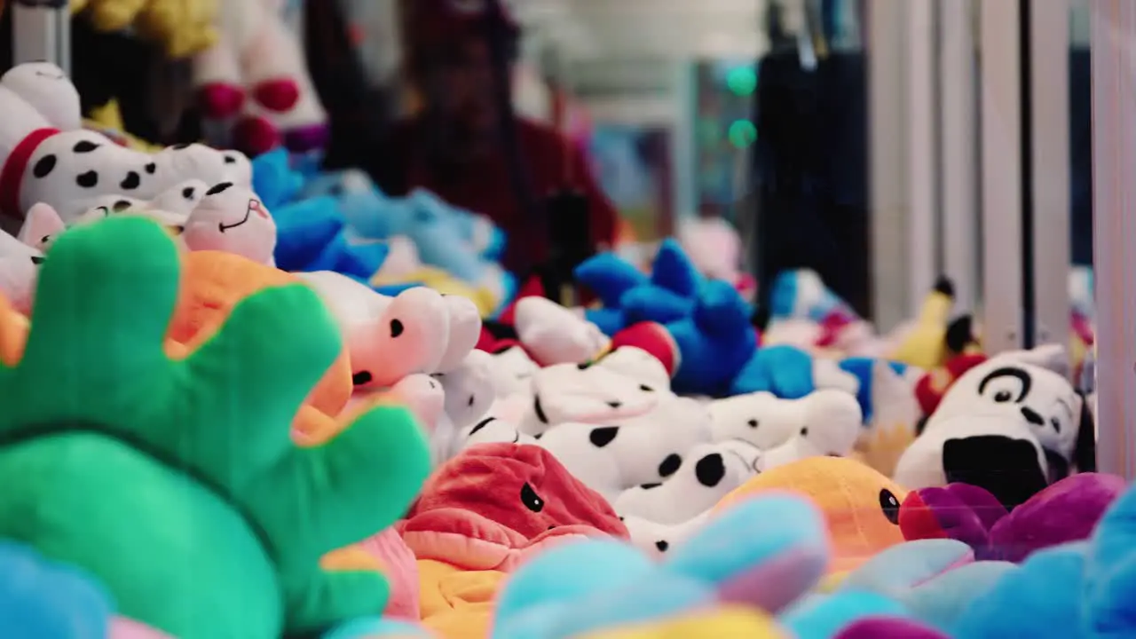 Claw Machine with cute fluffy animal toys failing to get a prize