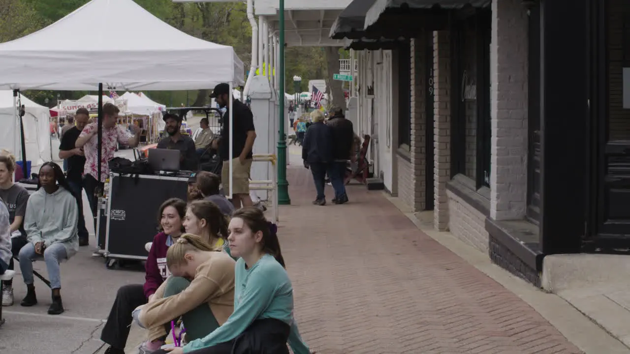 Young adults enjoy the music at the Dogwood festival Siloam Springs Arkansas