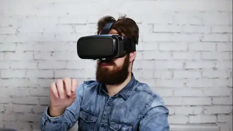 Man wearing virtual reality goggles in the office He is working using virtual reality Modern technology at work