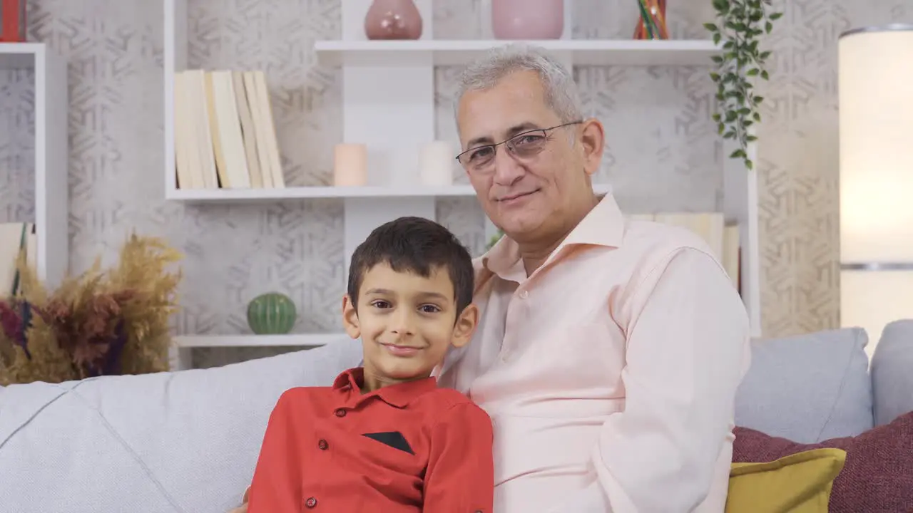 Father and son smiles looking at camera