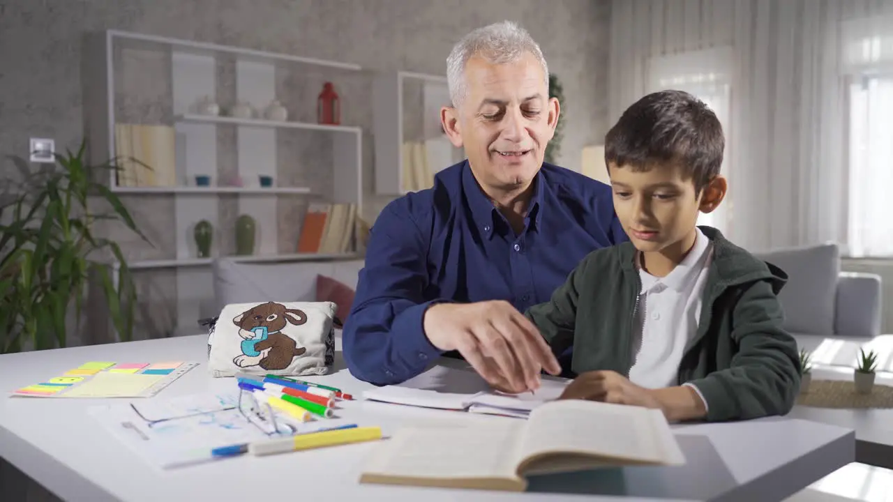 Father helping his son with his homework