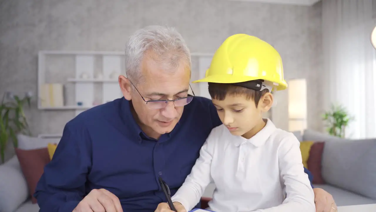 Happy father and son Little son helping engineer father