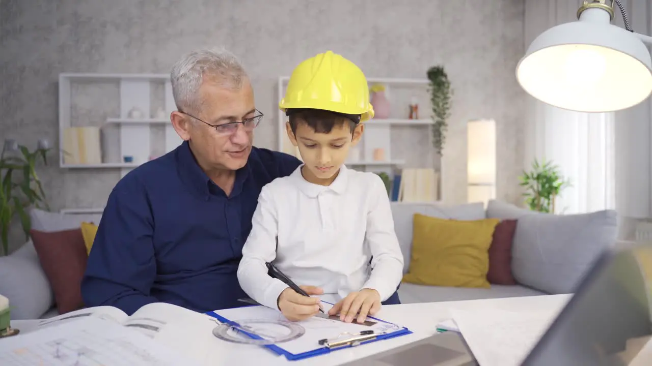 The younger son is helping his engineer father