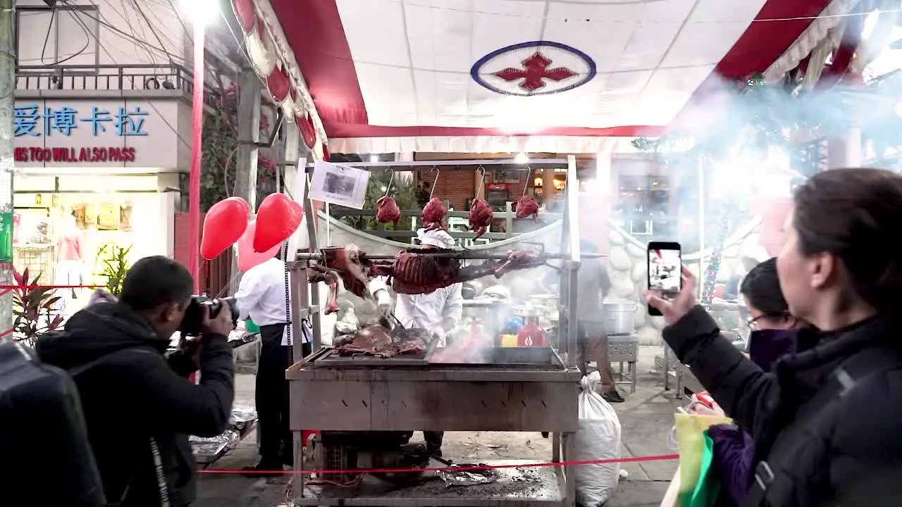 People photographing the grilled animal meat showcased at the 21st Street Festival Pokhara