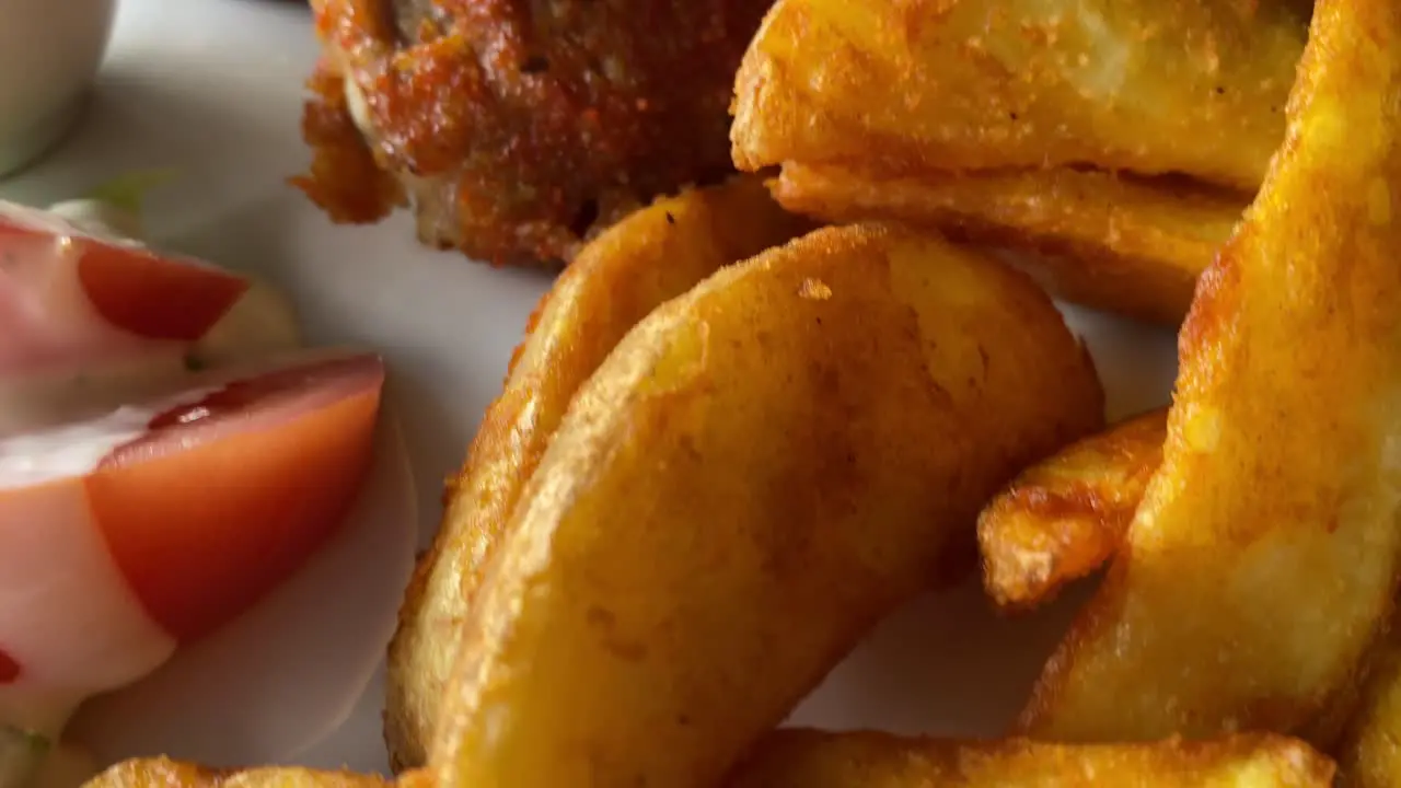 Pork chops and chips served in a restaurant in Iceland with close up video