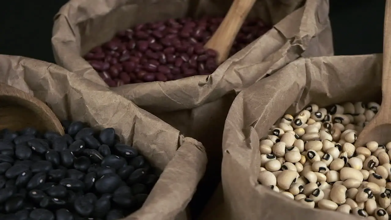 Narrow focus macro closeup Nutritious dry beans in paper bags rotate