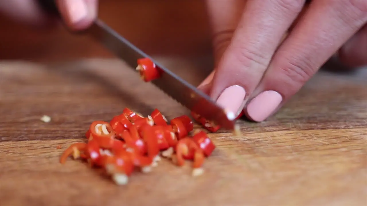 White Female Chef Chopping Chilli Pepper