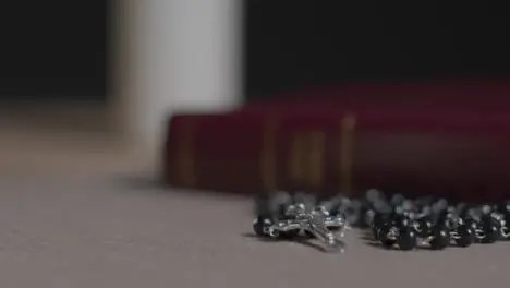 Tracking Shot of a Bible and Crucifix