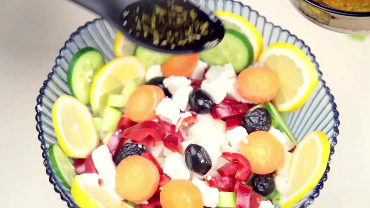 Man Making Salad In Kitchen