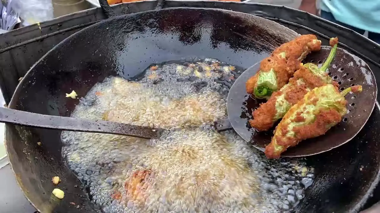 Close up shot of famous Indian street food called fried Spicy Chilli Pakora in West Bengal India at a roadside stall