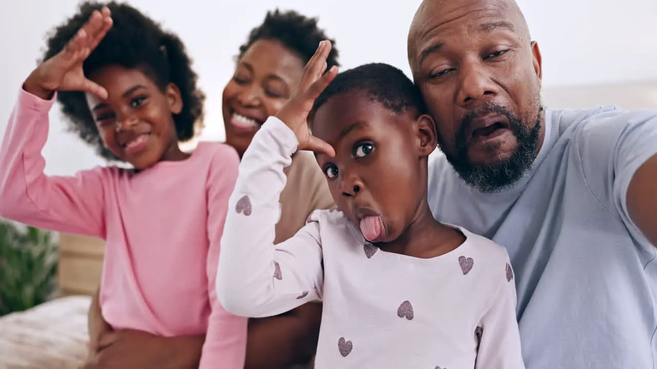 Funny selfie and black family bonding in bed