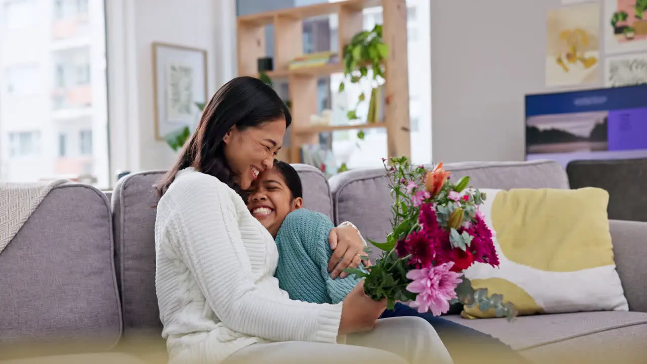 Mothers day gift girl and flowers on couch