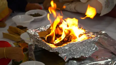 Worshippers Putting Ghee And Offerings Onto Flames Of Fire During Hindu Havan Ceremony 1