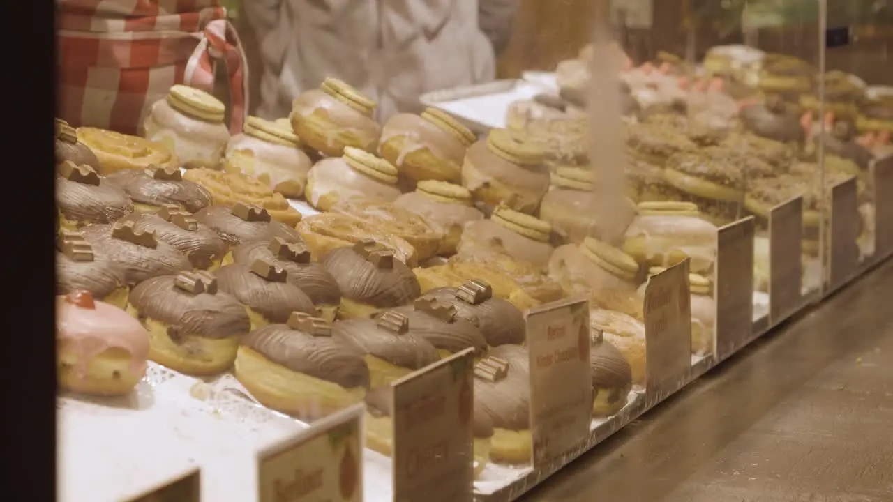 Close Up Of Stall Selling Donuts At Frankfurt Christmas Market In Birmingham UK At Night 4