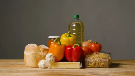 Studio Shot Of Basic Food Items On Wooden Surface And White Background 2