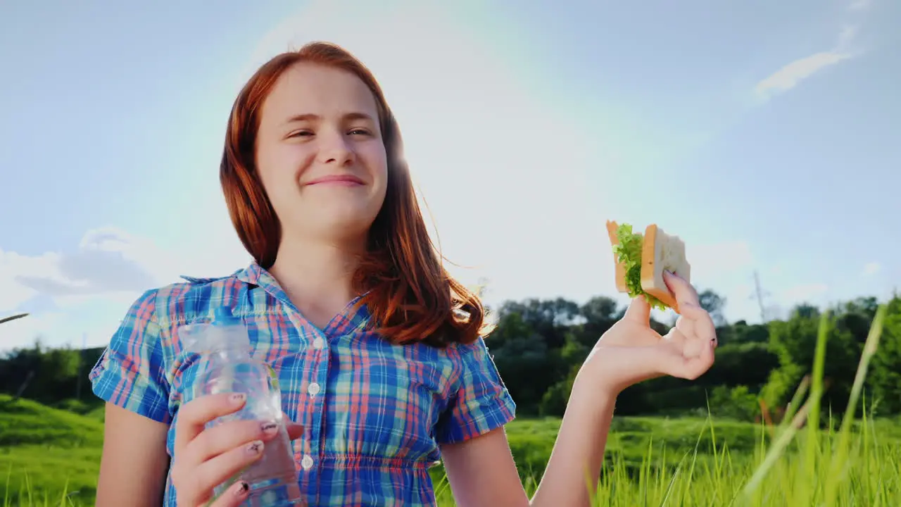 Portrait Of A Teenage Girl Eating A Sandwich 1