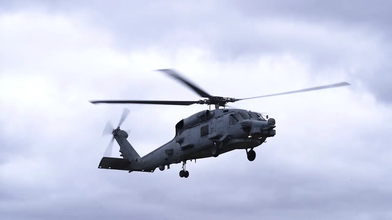 Sikorsky SH-60 Aircraft On Flight Over Sky With Clouds