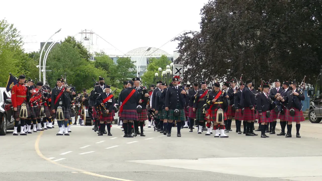 Formation of Police Pipe Band In Uniform during Military funeral Toronto Canada