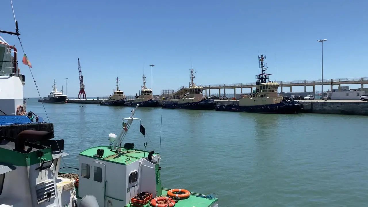 zoom in to some armed forces ships on the port in Alcântara Portugal