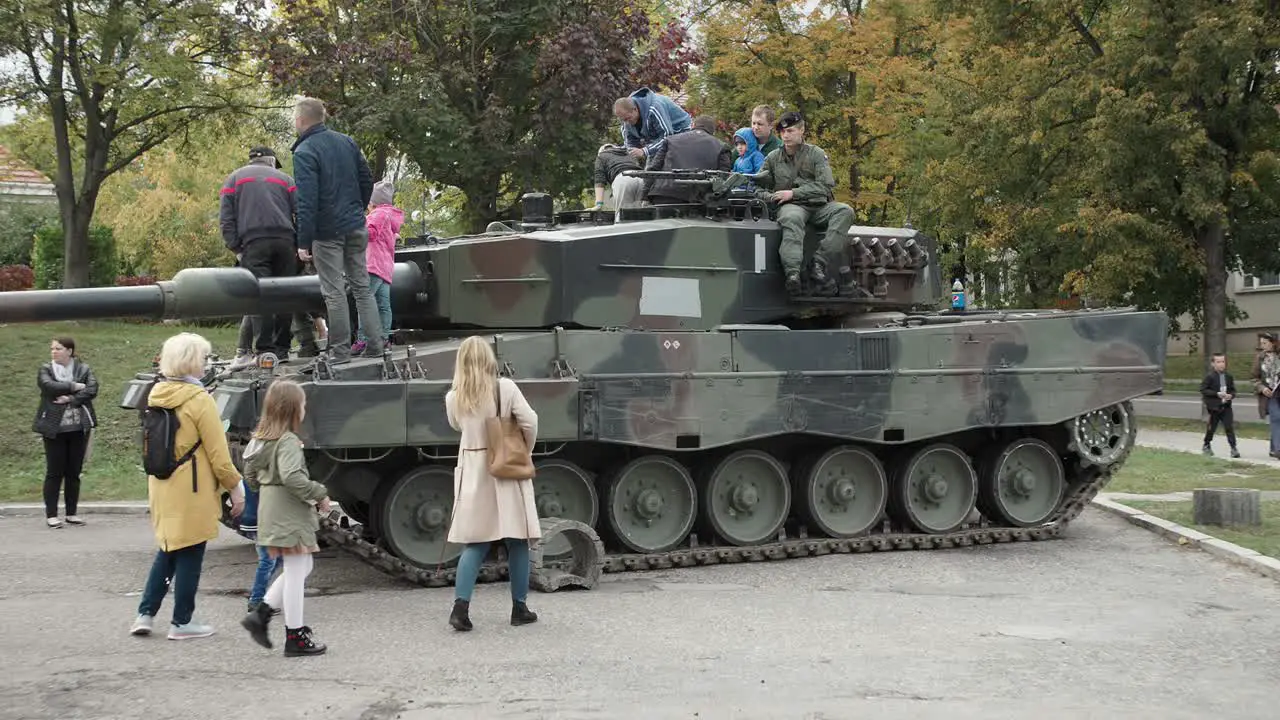 Children are watching and playing on the tank