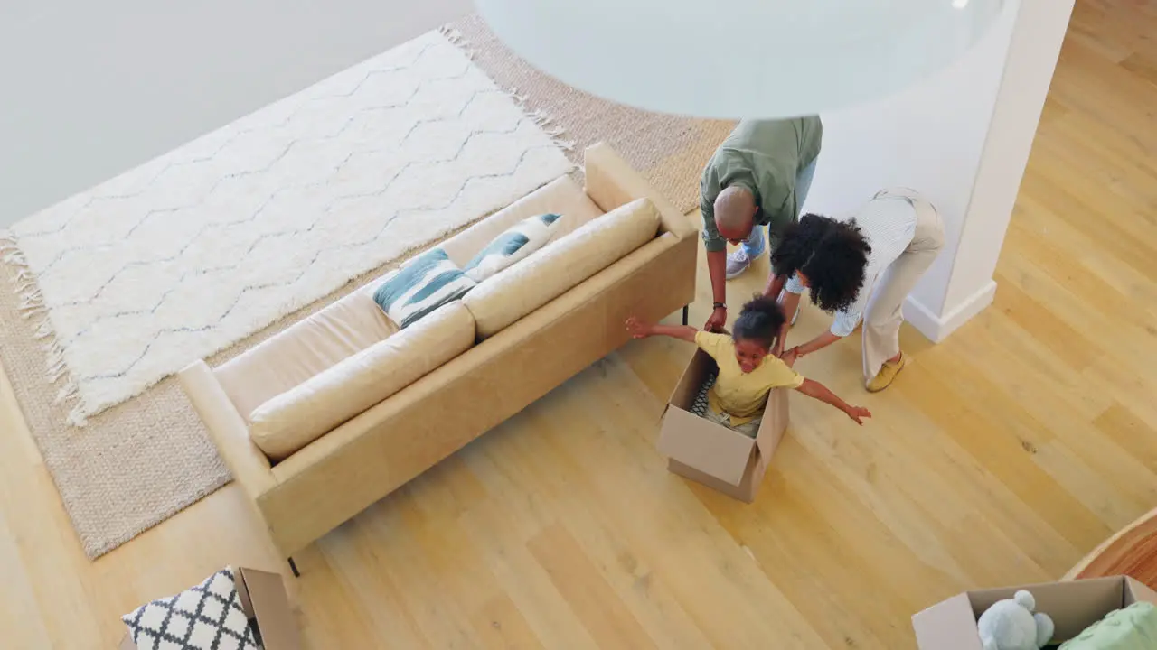 New house box and girl child playing with parents