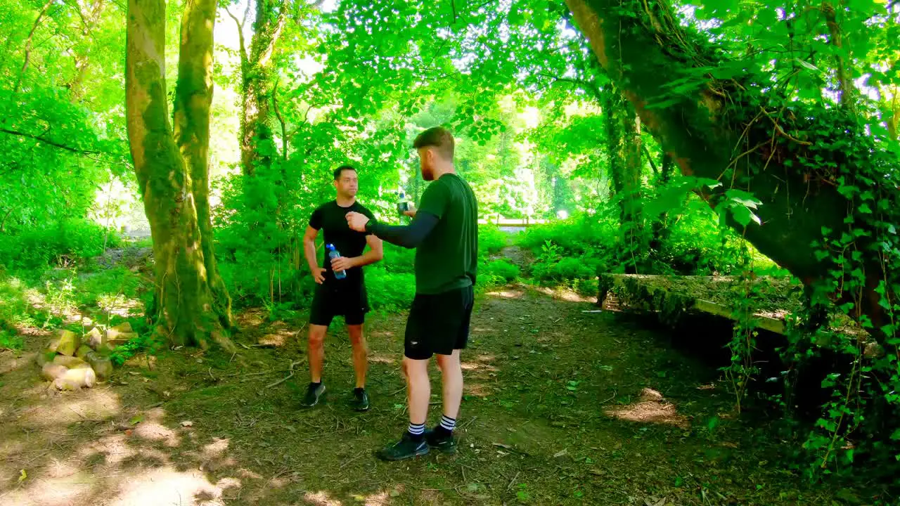 Fit man training on fitness trail 4k