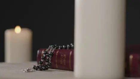 Close Up Shot of a Bible and Crucifix