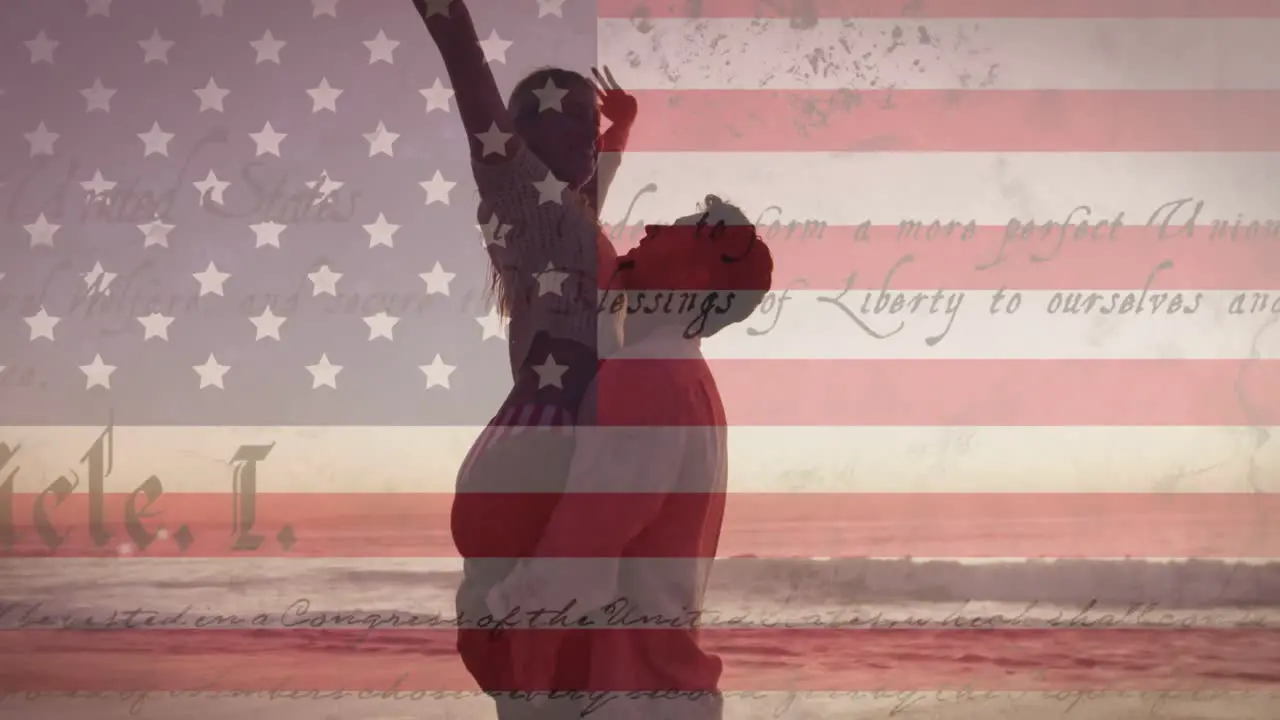 Constitution text over american flag against couple embracing each other at the beach