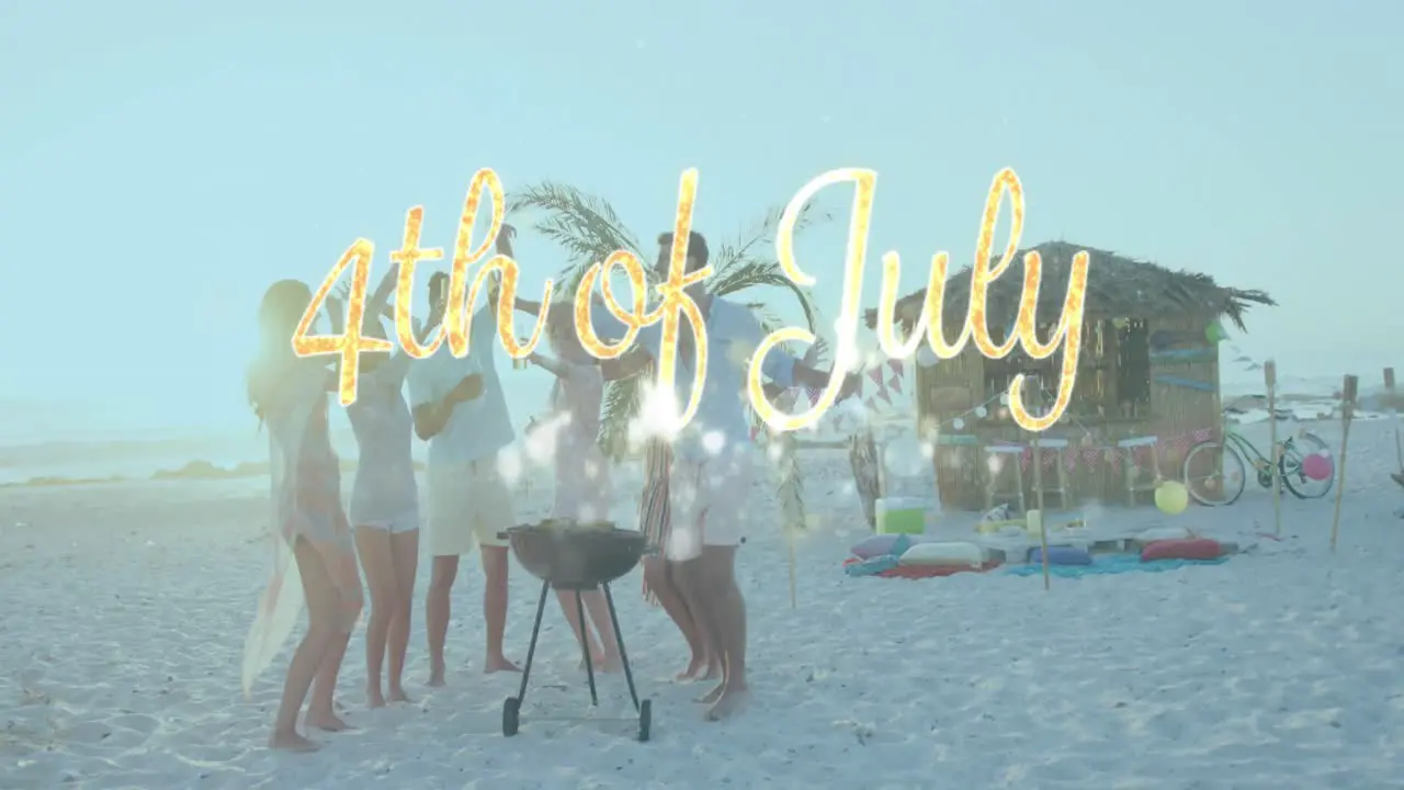 Independence day text and spots of light against group of friends partying on the beach