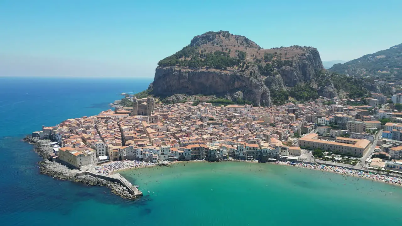 Cefalu City Beach and Rock during Summer in Sicily Italy Aerial 4k