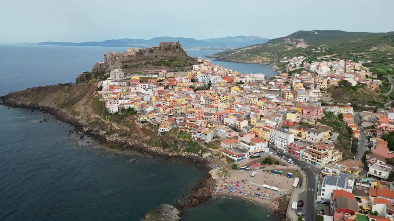 Castelsardo beach castle and colorful fortified town in Sardinia Italy 4k Drone Aerial