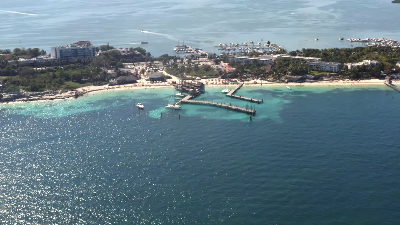 Touristic resort and tropical beach with piers and blue sea in Cancun