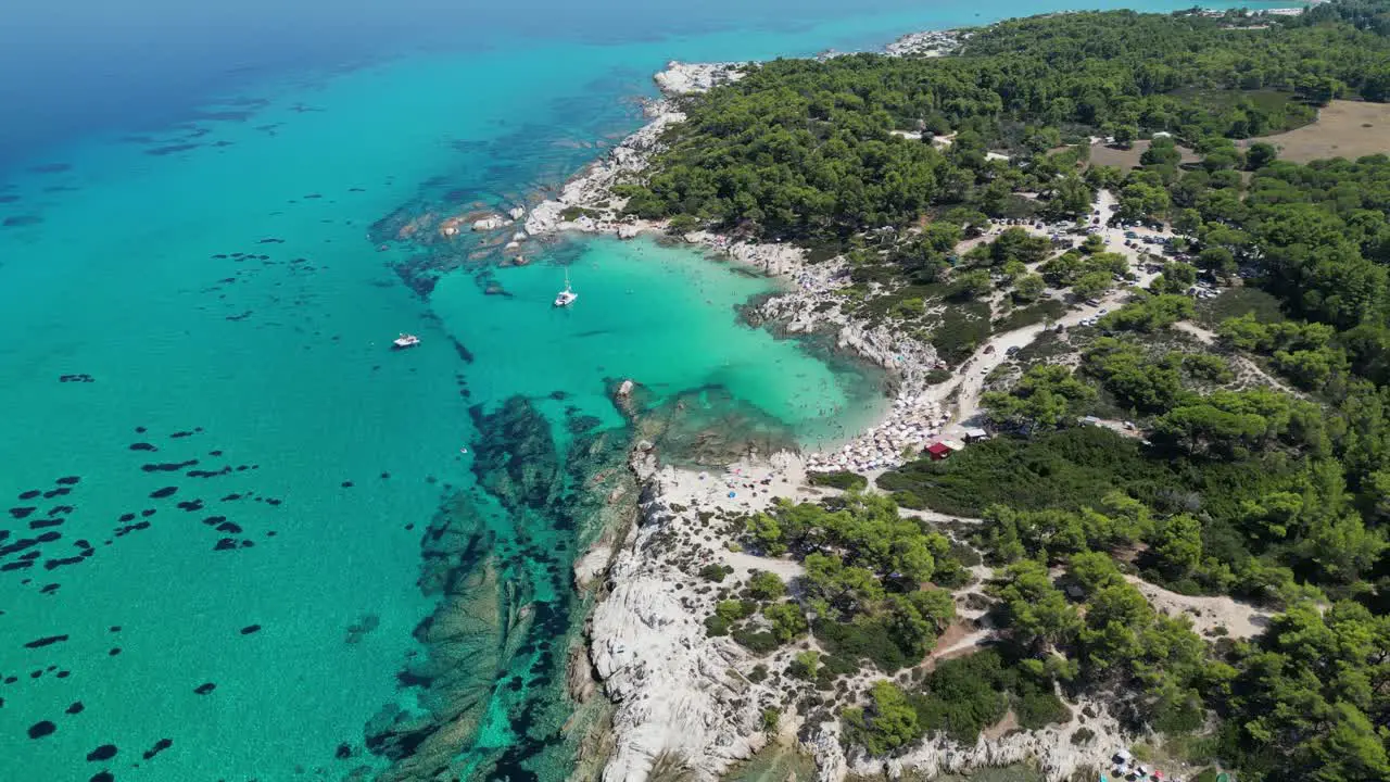 Halkidiki Beach Kavourotrypes and Clear Blue Sea Coastline in Greece Aerial 4k