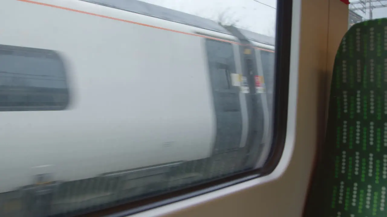 Looking out from moving train passing another train