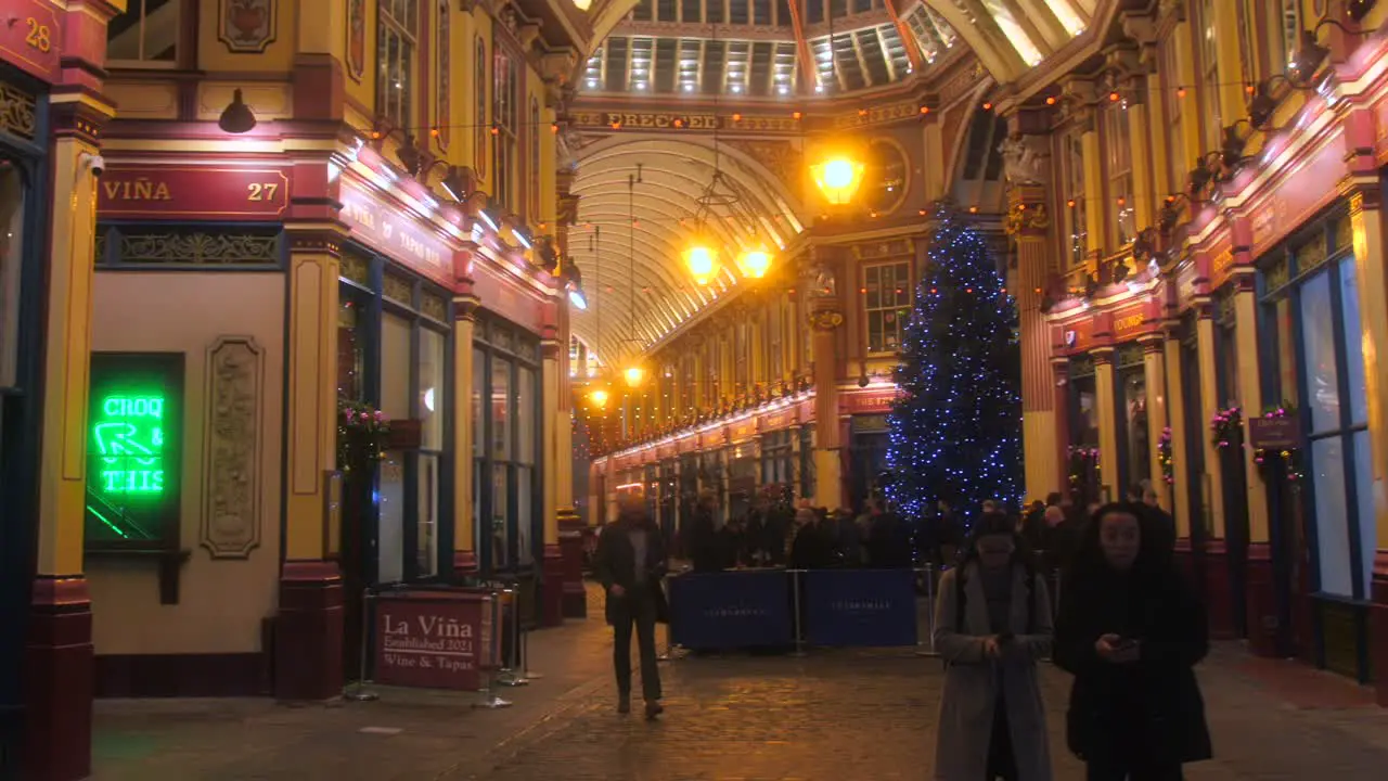 Christmas Holiday Spirit At Leadenhall Market With People Rushing At Night In London England