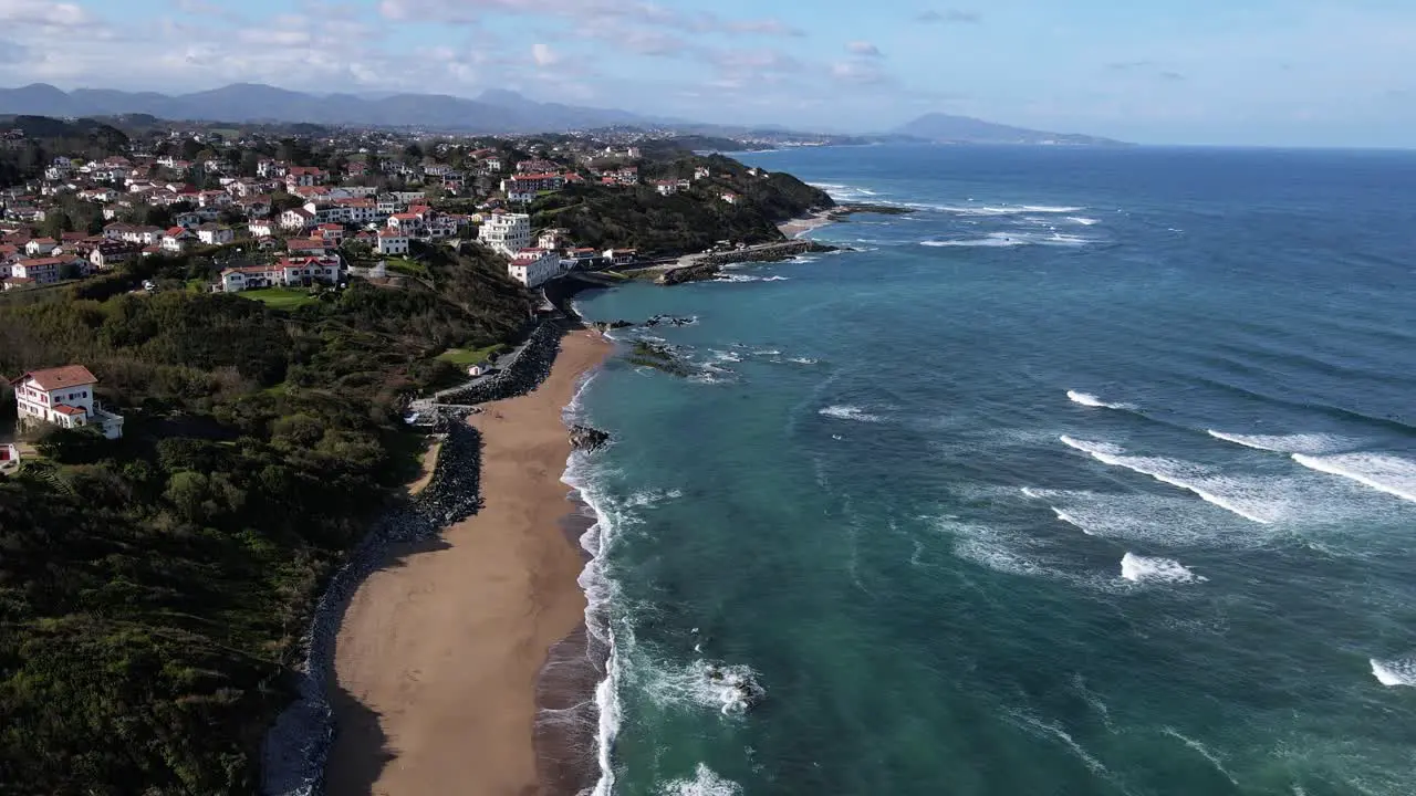 View of the French Basque Country Coastline from Bidart Parlamentia Surf Break to Guethary and all the way to Spain with waves breaking below and mountains in the background