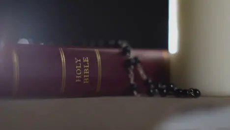 Close Up Shot of a Bible and a Crucifix