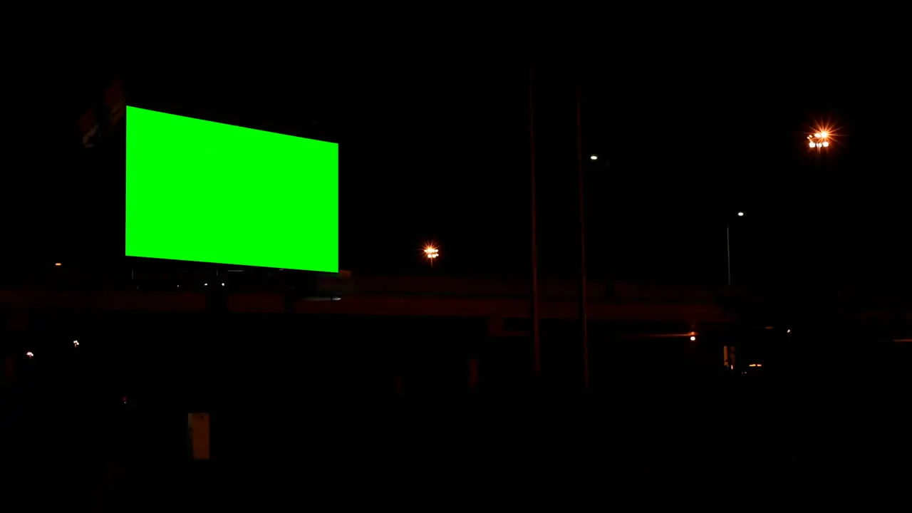 Empty billboard with chroma key green screen at night 4k