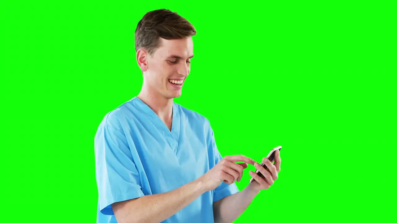 Male doctor using mobile phone