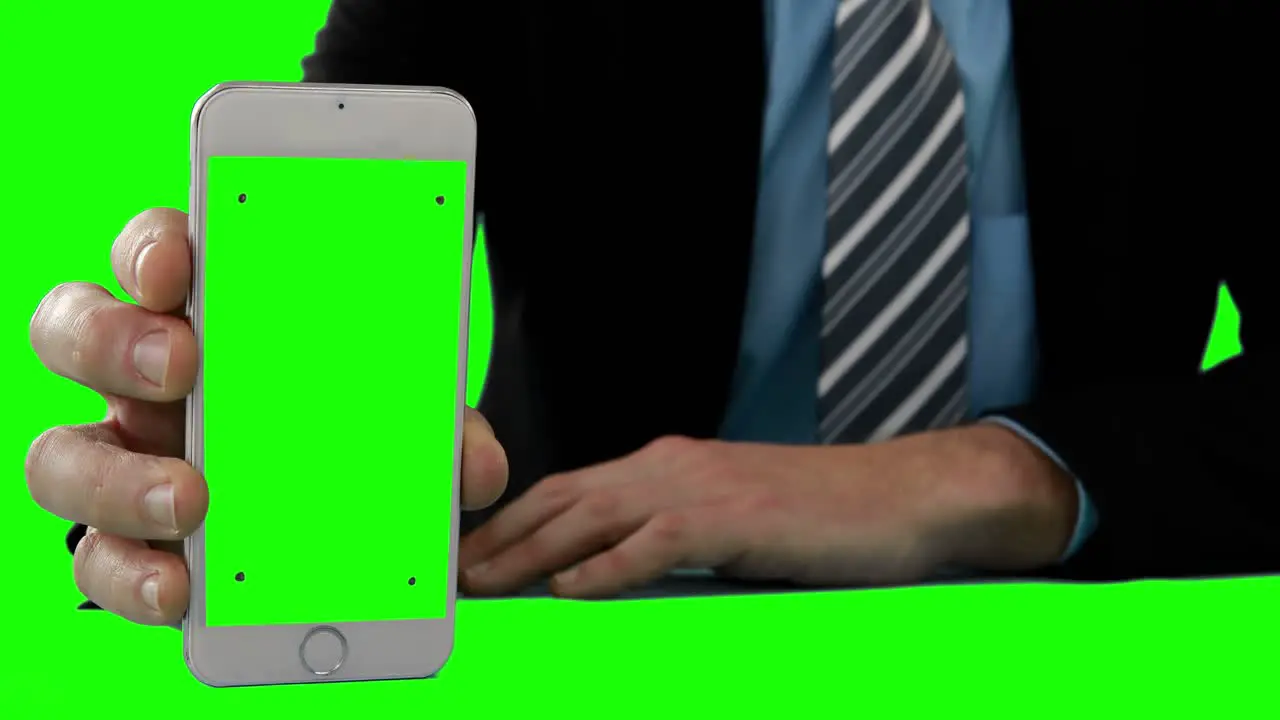 Businessman showing a smartphone