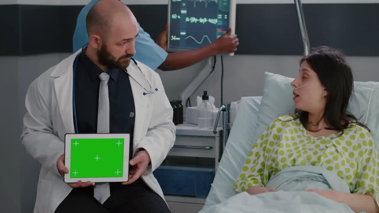 Specialist man in white coat talking with sick woman about illness recovery treatment