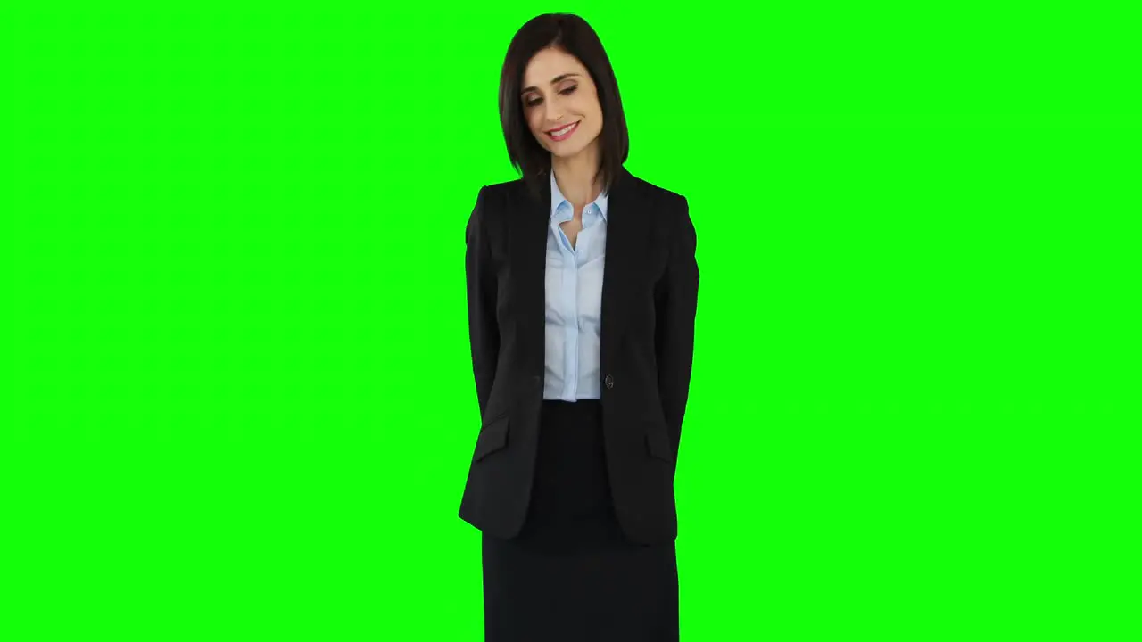 Smiling businesswoman pointing at screen 