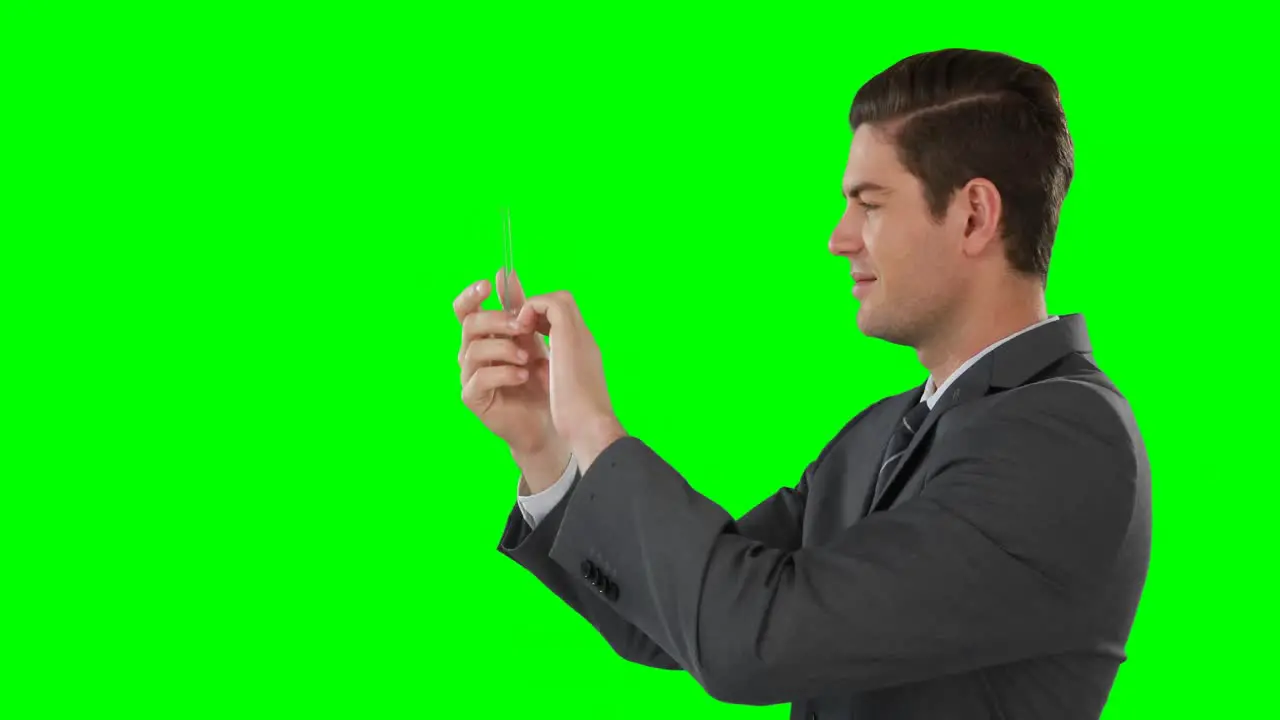 Businessman pretending to use mobile phone