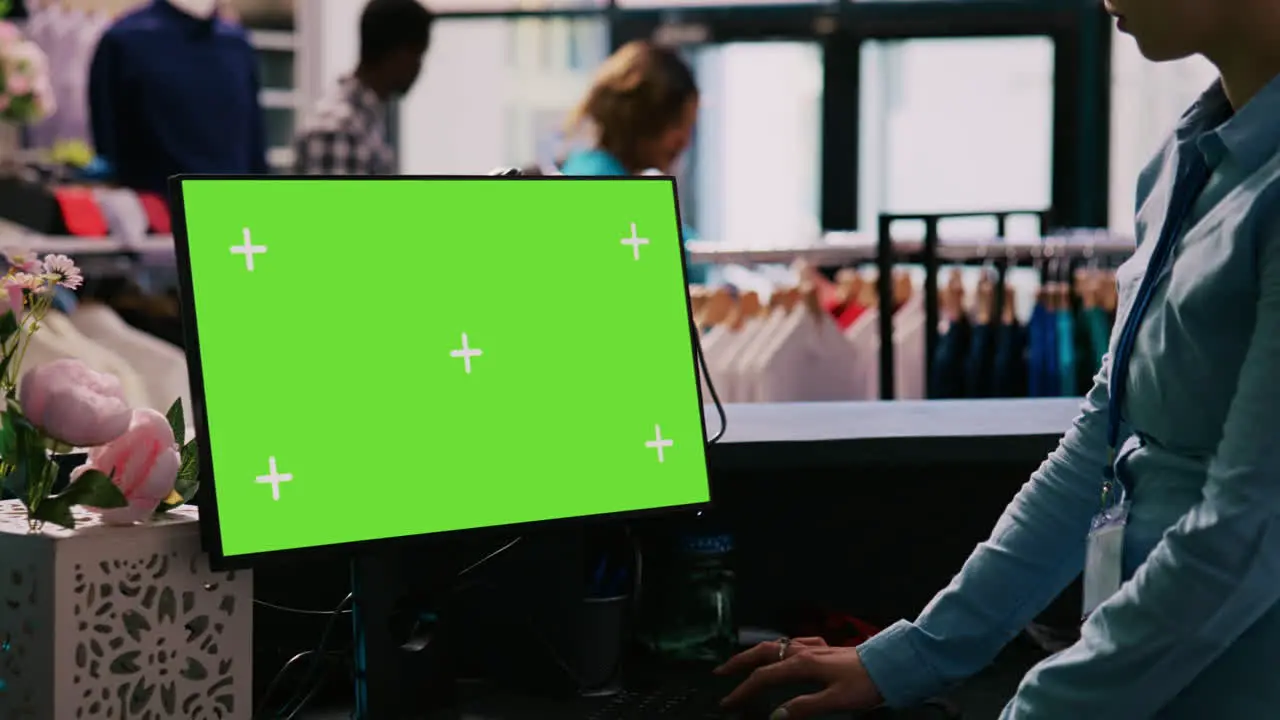 Worker checking pc with green screen