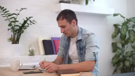 Focused businessman working in office interior Male worker answering on phone call Man talking smartphone at remote workplace Business man calling phone at office